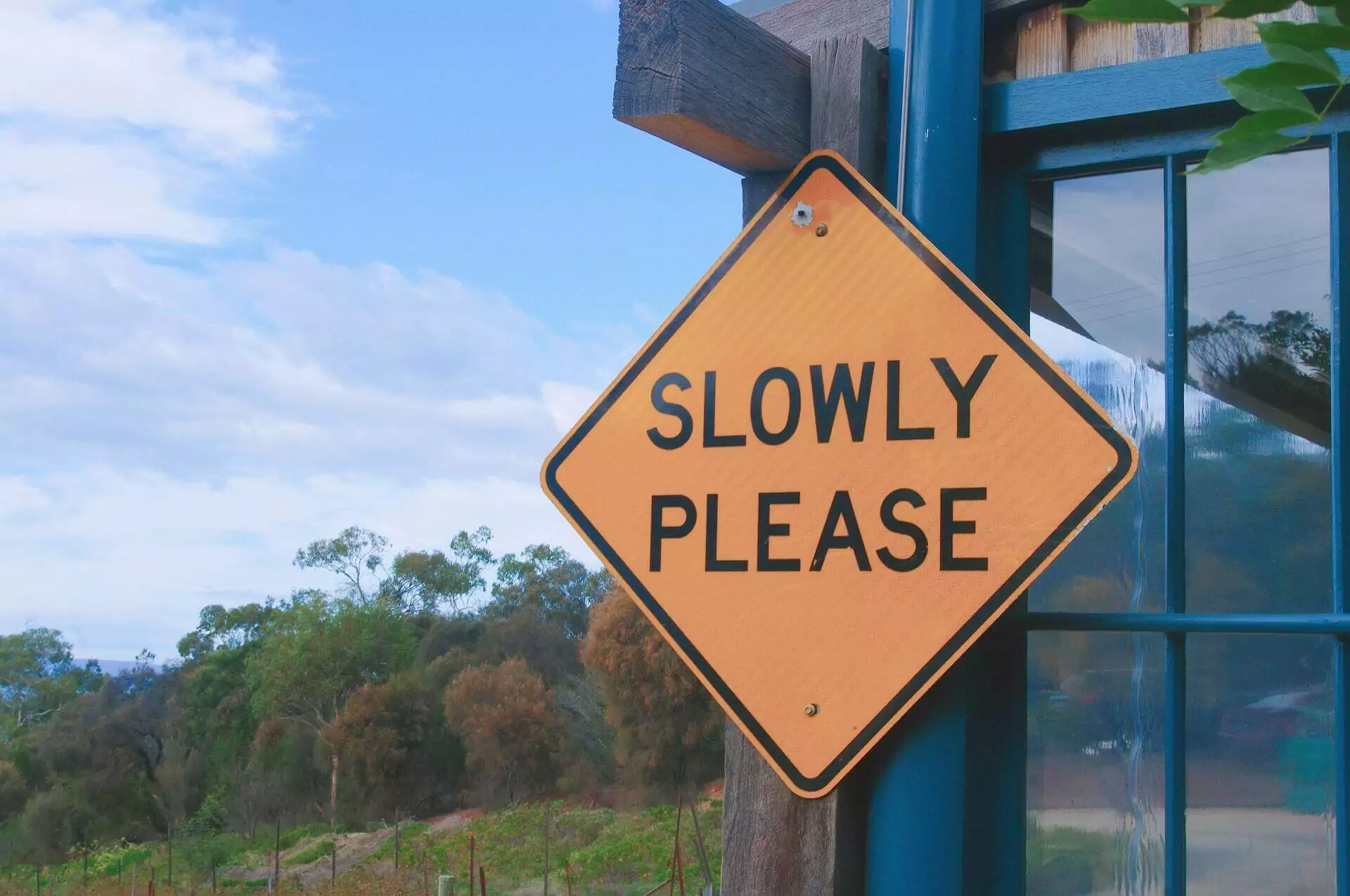 Slowly Please road sign