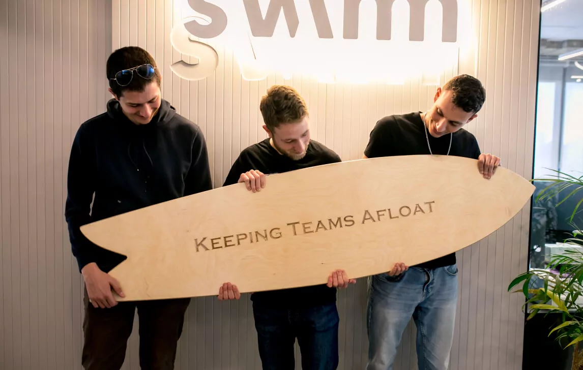 Swimm Team with surf board